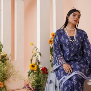 Model in a blue salwar kameez with floral decor, Lahore, Pakistan